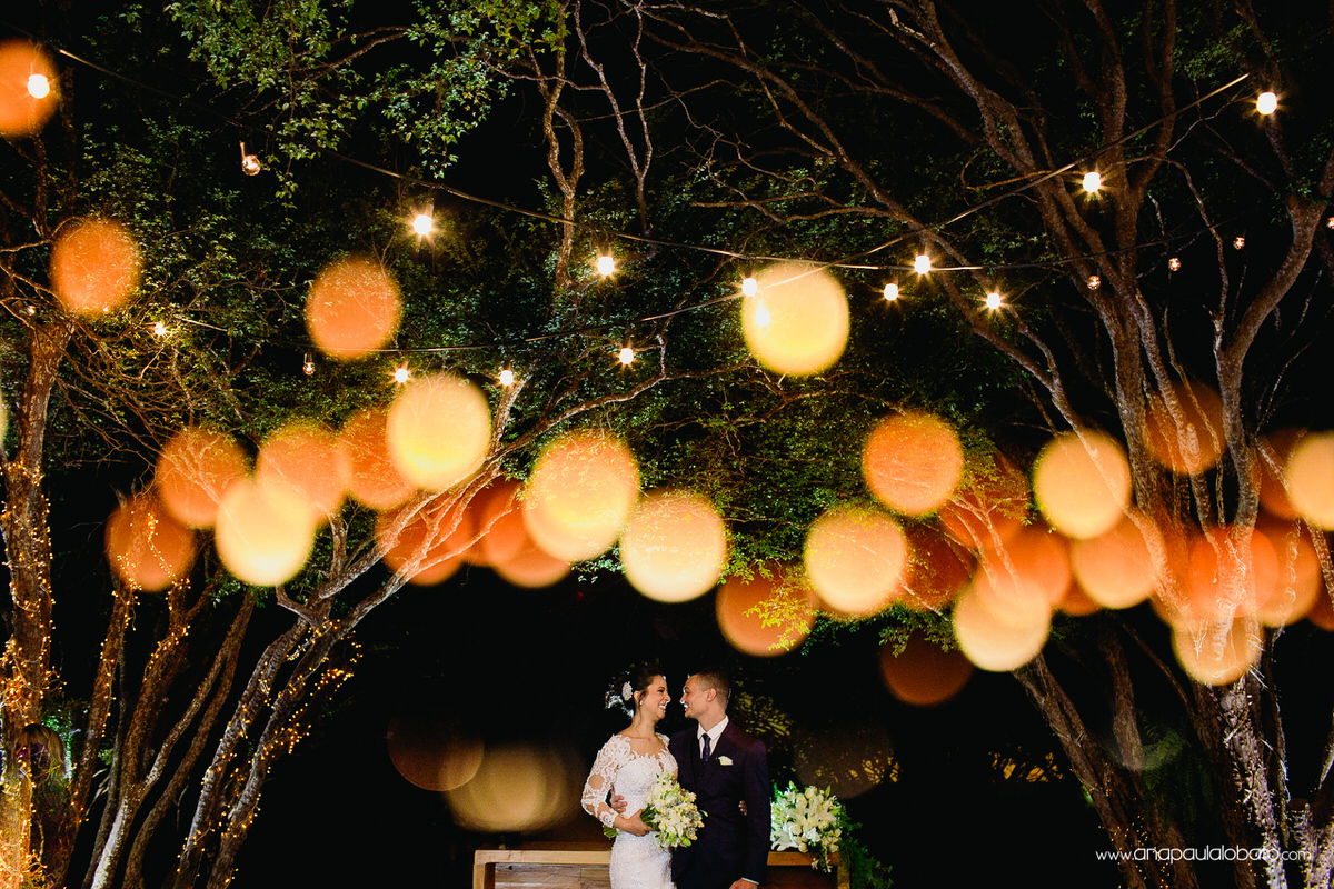 Wedding couple in the altar surrounded by little lights